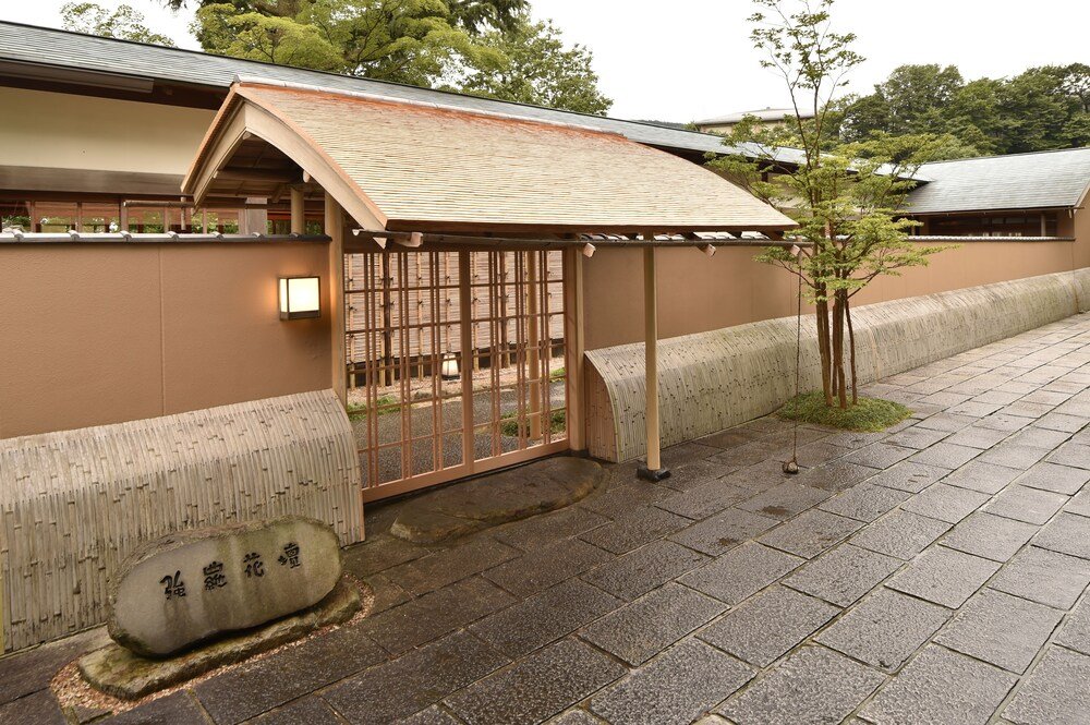 Traditional Japanese building with a tiled roof among trees